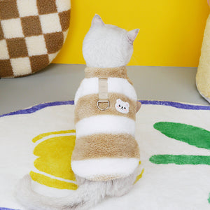 Side view of a cat wearing the striped fleece jumper