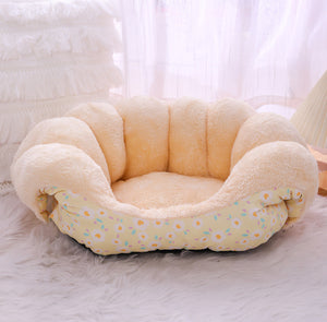 Floral cat bed arranged as a covered cave