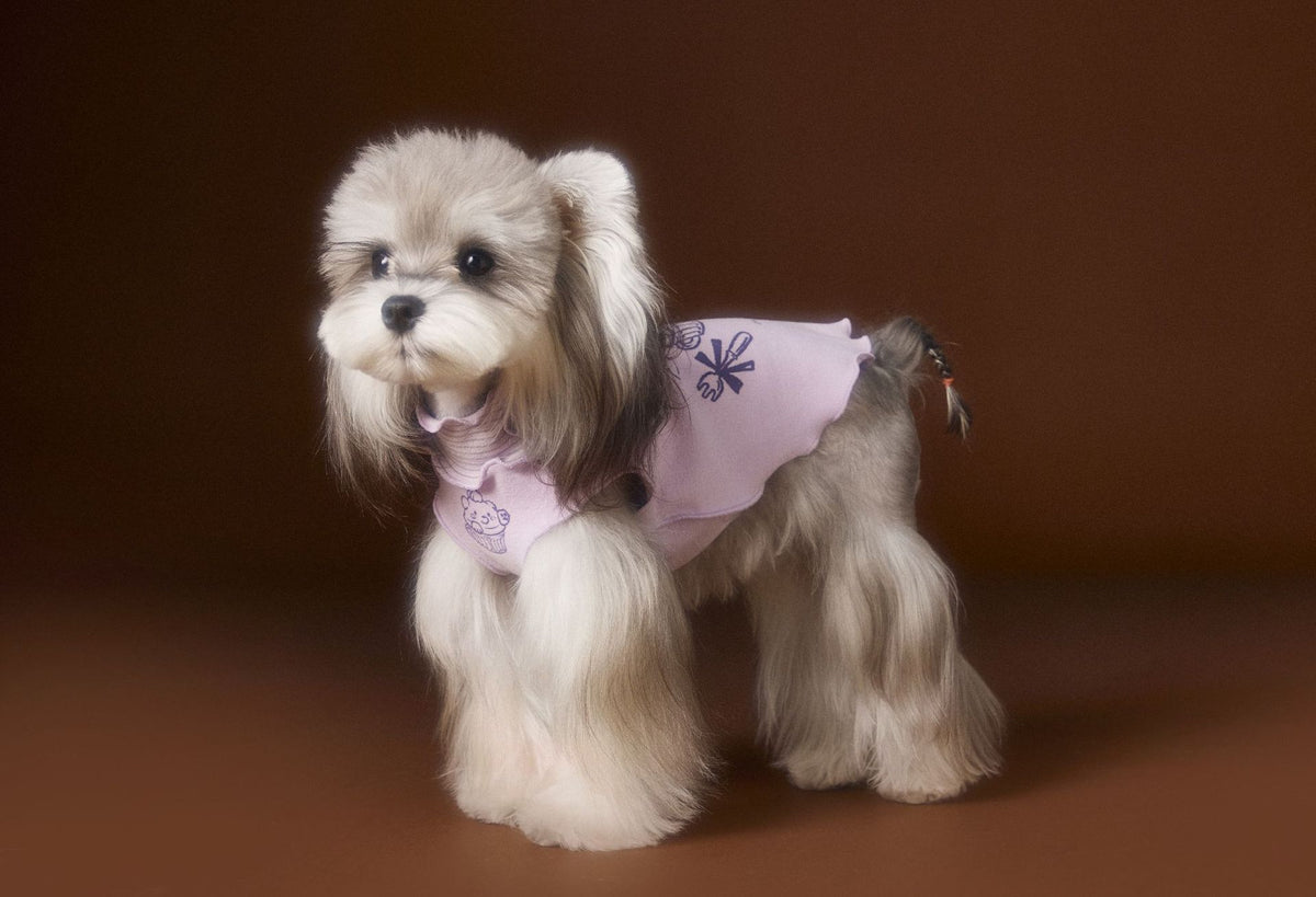 Back of purple cartoon dog T-shirt with wavy hem