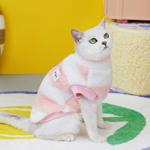 Cat wearing the wine red and pink striped fleece pullover