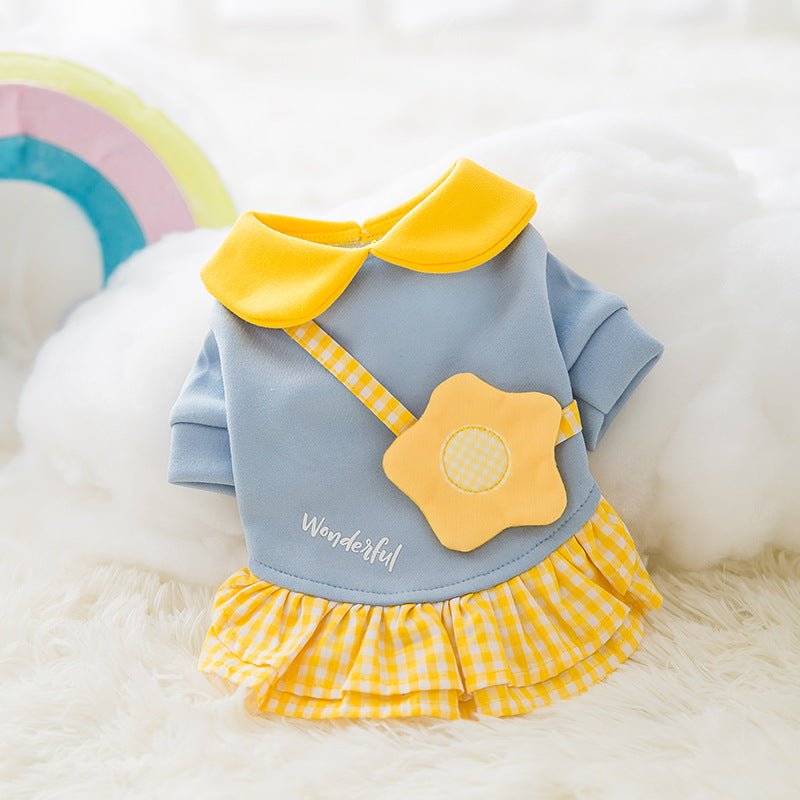 Flower-shaped decorative faux purse attached to the blue dog dress