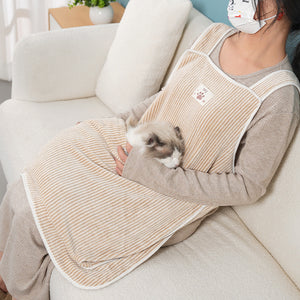 Cat owner using the petting apron during grooming time.