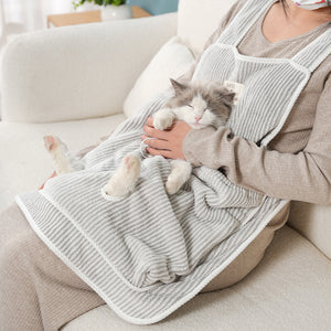 Cat petting apron helping keep loose fur off clothing.