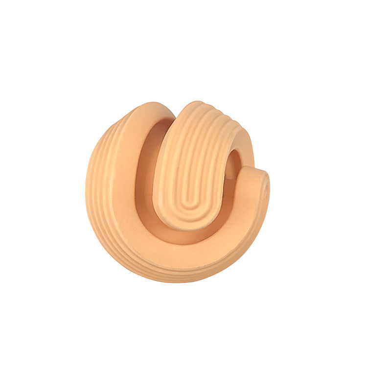 Close-up of the PAWABY dental chew toy with textured grooves.