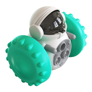 Dog using the interactive feeding toy to access hidden treats.