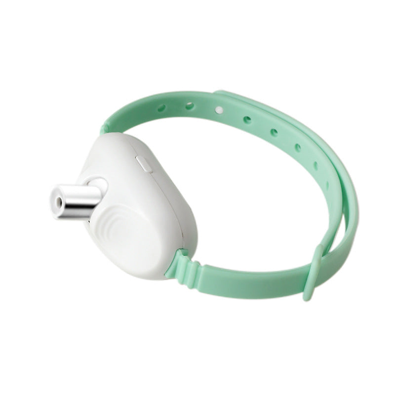Cat wearing the PAWABY Smart Laser Cat Collar during supervised play.