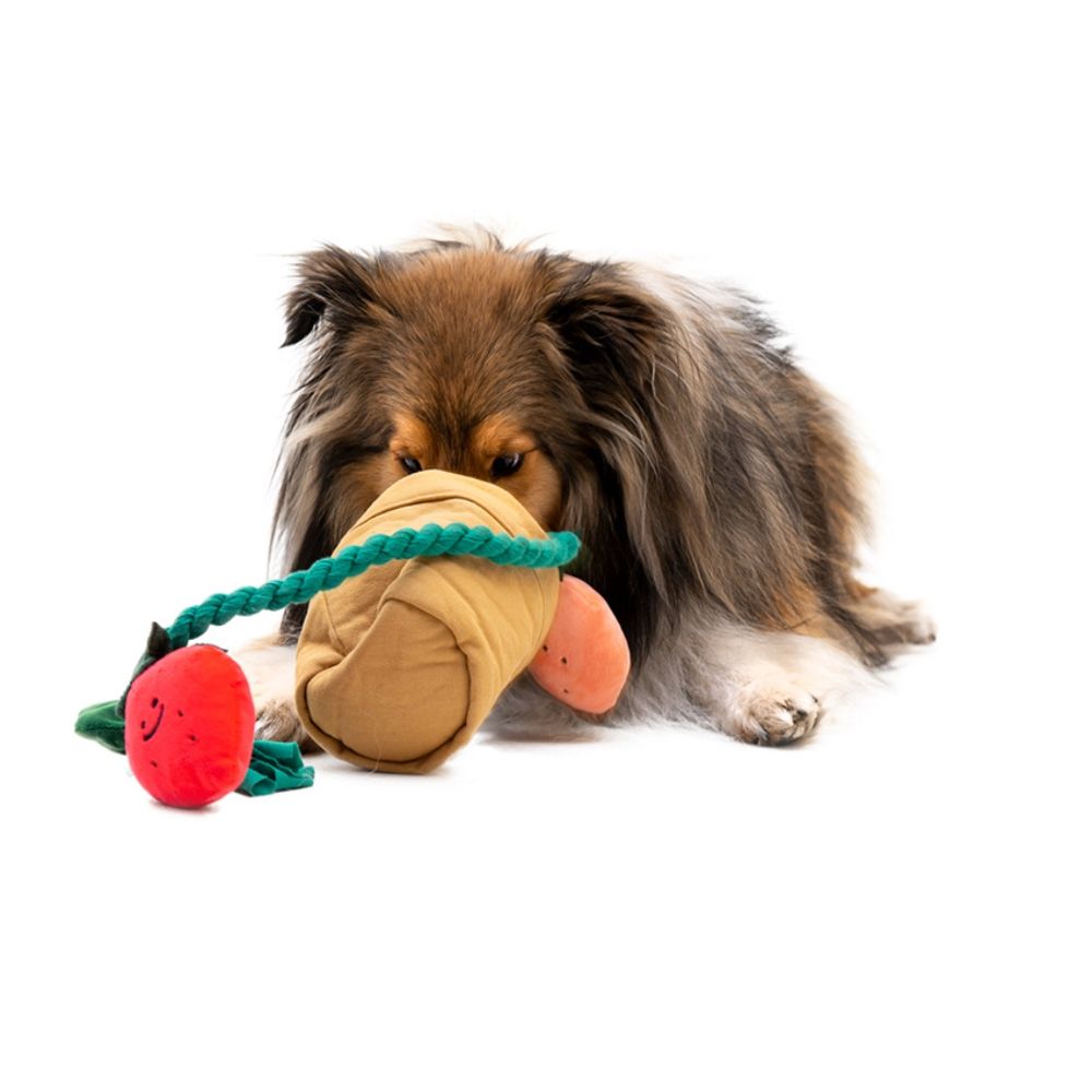 Dog enjoying the PAWABY Strawberry Garden Snuffle Toy at home.