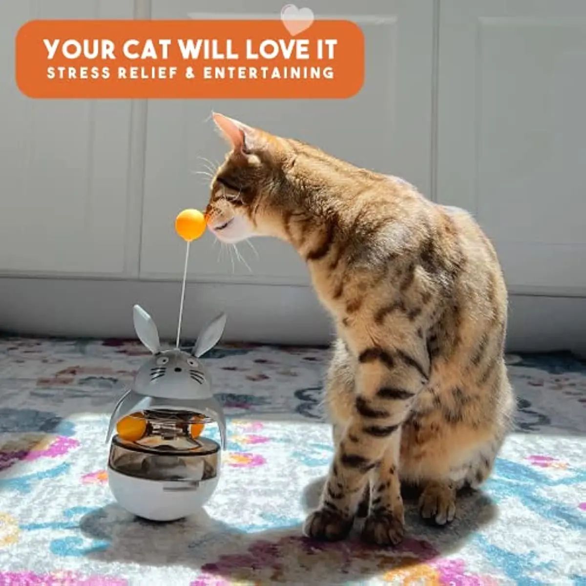 Cat interacting with the PAWABY feeding toy at home.
