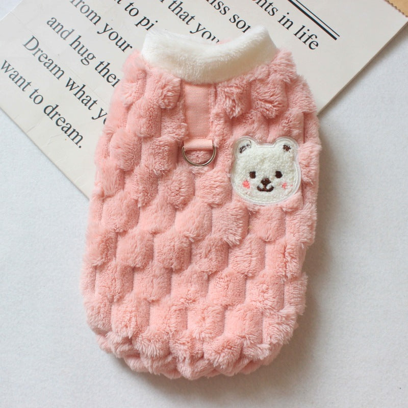 Small dog wearing pink bear-patch gilet